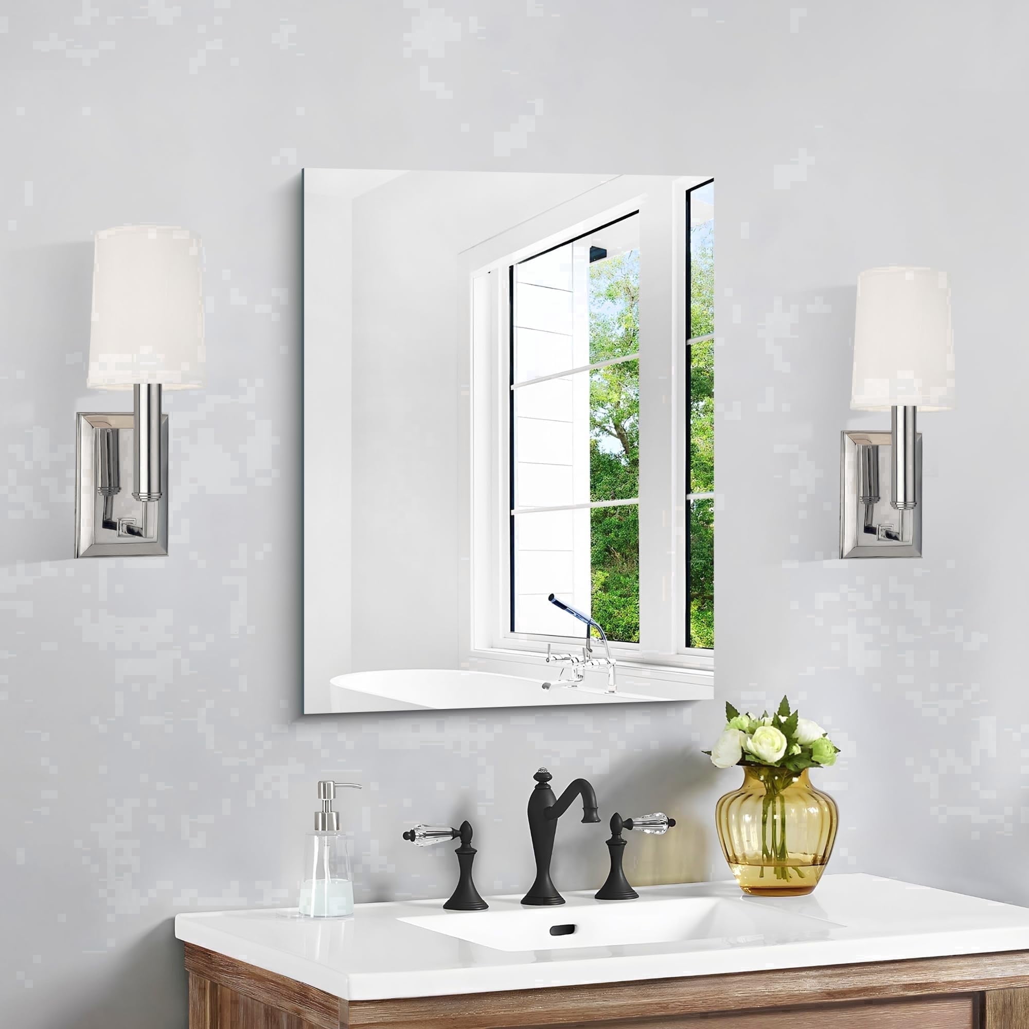 Frameless polished-edge bathroom mirror in a bright interior